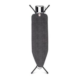 An ironing board features a sleek black fabric cover, standing tall on a sturdy black metal frame. It includes a handy rectangular metal rest at the top, perfect for holding an iron.