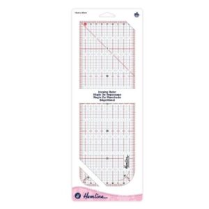 A Hemline ironing ruler in its packaging. It features a grid with measurements and angles marked. The white packaging displays dimensions of 15cm x 30cm.