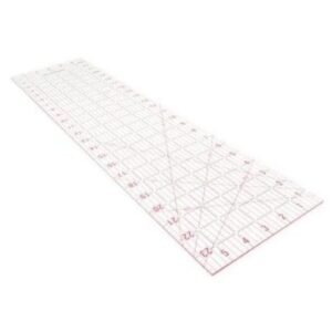 A long clear plastic ruler, featuring red measurement markings and grid lines. Perfect for quilting or sewing, the ruler includes numbers from 1 to 24 and angled guidelines.